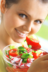 young beautiful woman eating healthy food