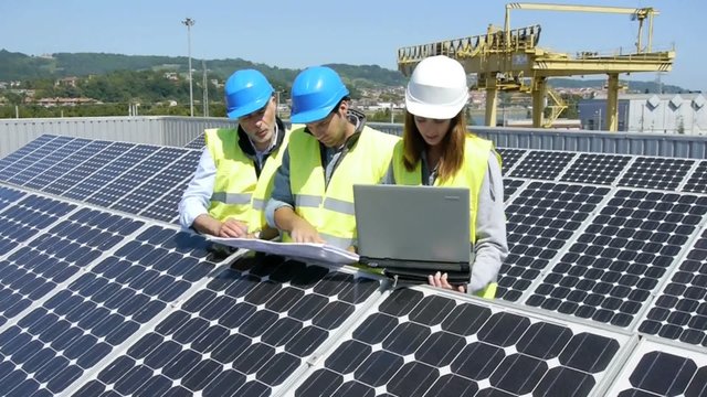 Engineers checking solar panels setup