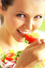 young beautiful woman eating healthy food
