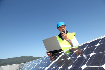 Engineer checking photovoltaic installation