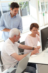 Senior people attending business training