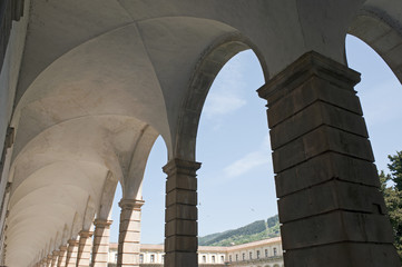 An old cloister with arched portico