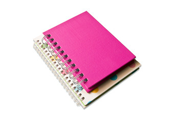 white and pink notebook on white background