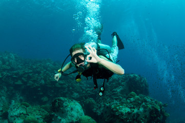 scuba diver exsplore coral reef in the ocean