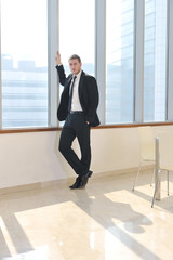 young business man alone in conference room