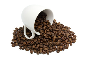 White cup with coffee beans isolated in white