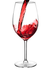 Pouring red wine into wine glass (isolated on white)
