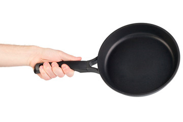 Frying pan in a hand isolated on white background