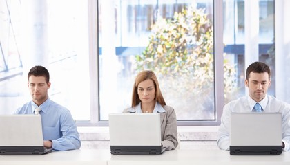 Young businesspeople sitting in meeting room