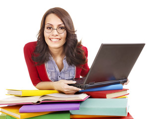 Girl with stack color book  and laptop.