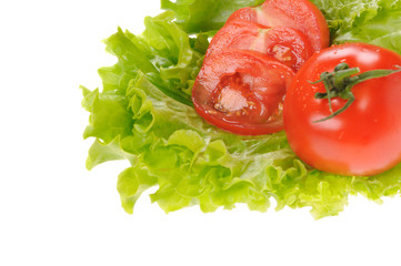 green salad and sliced tomato isolated on the white background