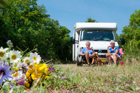 Couple Is Traveling By Camping Car