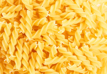 Fusilli swirl pasta forming a background