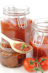 Fototapeta na wymiar Tomato sauce and fresh tomatoes