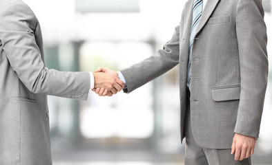 Business men hand shake in the office