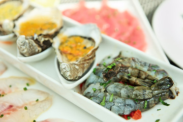 Plate with oysters, seabass and shrimps