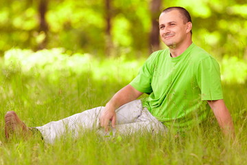 Young man relaxing in the forest