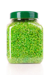 Green aromatic bath salt in bottle isolated on white