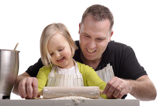 Father And Daughter Cooking Together