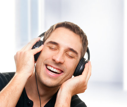 Smiling man listening the music