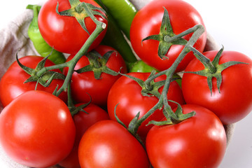 Close-up of red tomatoes and green peperoni