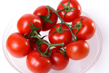Red tomatoes in a cup