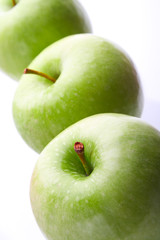 Three ripe green apples