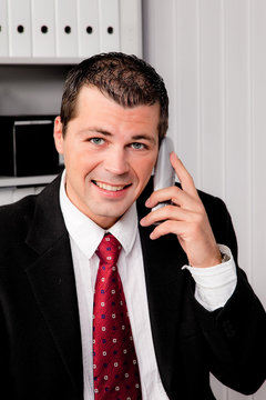 Businessman in office with telephone