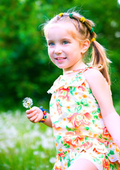 Cute little girl  on the meadow