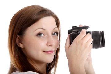 young woman with single-lens reflex camera (white background)