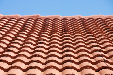 Red Tile Roof Under Blue Sky