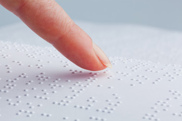 Braille and finger. Book in Braille - obrazy, fototapety, plakaty