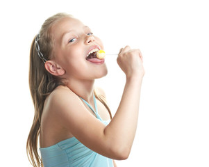 Cheerful little girl with lollipop