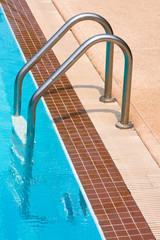 Metal ladder to swimming pool