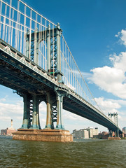 Manhattan bridge in New York City with beautiful blue sky