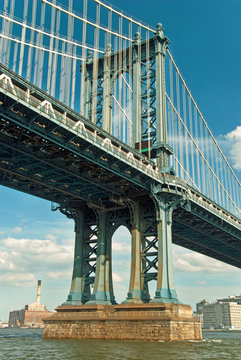 Manhattan bridge in New York City with beautiful blue sky © Vacclav