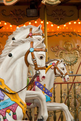 Fototapeta na wymiar Three carousel horses