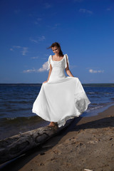 bride balancing on trunk