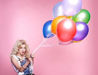 blonde girl with balloons