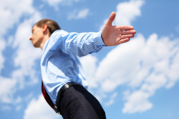 young business man in a blue shirt and red tie