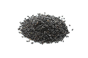 black sesame seeds piled on white background