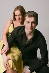 Young couple on a gray background