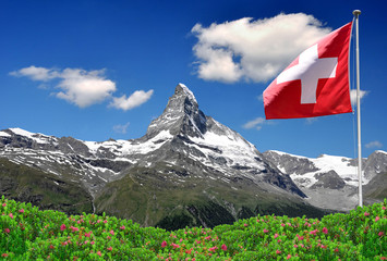 Beautiful mountain Matterhorn with Swiss flag - Swiss Alps