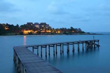 Fototapeta premium Tropical Island Resort with Pier at Twilight