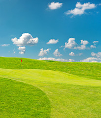 golf field. beautiful green landscape with blue sky