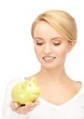 lovely woman with piggy bank