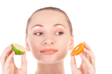 model posing with slice of juicy orange and half of lime