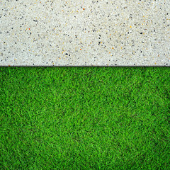 Fresh green grass on concrete background