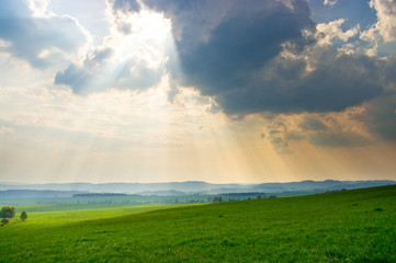 Green scene with dramatic sky