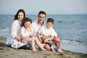 Fototapeta premium happy young family have fun on beach